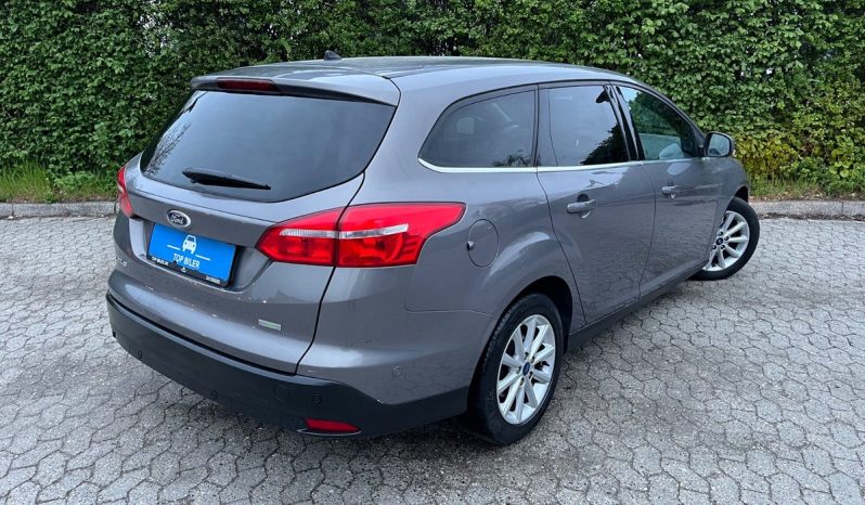 
								Ford Focus 1,0 SCTi 125 Titanium stc. 5d full									